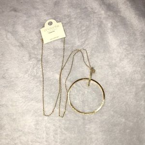 Gold colored circle bar long necklace